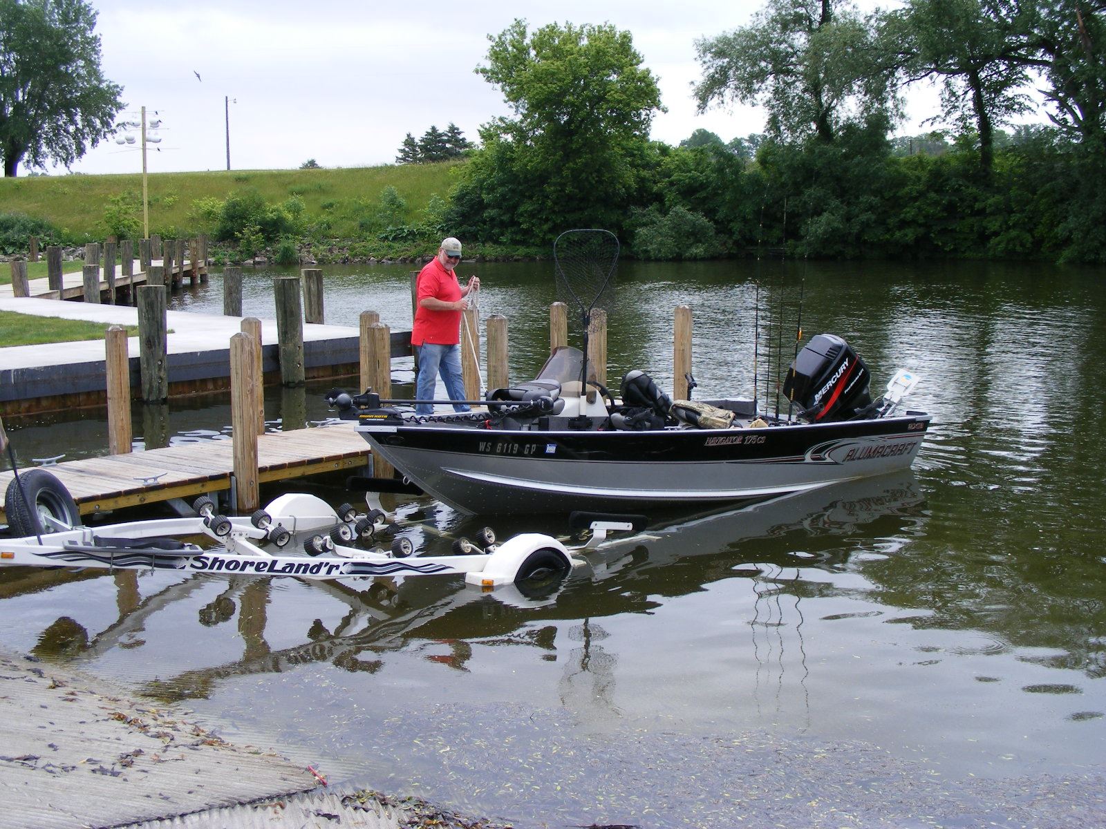 Brothertown Harbor boat in water leaving harbor. 